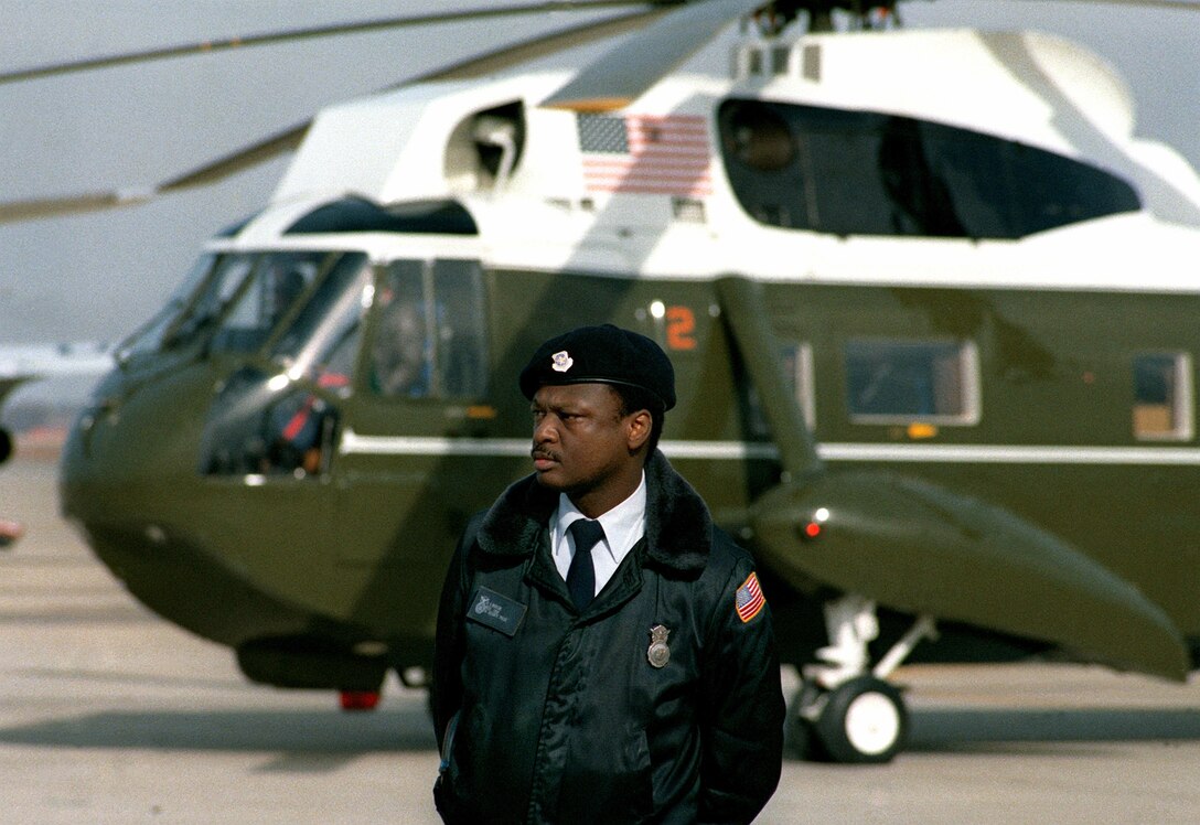 On President Ronald W. Reagan’s Inauguration Day Jan. 20, 1981, an Air Force security policeman stands guard on the side of one of the presidential helicopters (VH-3A) at Andrews Air Force Base.