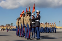 U.S. Marine Corps drill instructors with Lima Company, 3rd Recruit Training Battalion, prepare to retire the guidons as a part of a graduation ceremony at Marine Corps Recruit Depot San Diego, California, Jan. 17, 2025. Graduation took place at the completion of the 13-week transformation, which included training for drill, marksmanship, basic combat skills, and Marine Corps customs and traditions. The Marine Corps has served the Nation honorably for 250 years. Marines embody the uncompromising standards and characteristics of honor, courage and commitment. (U.S. Marine Corps photo by Lance Cpl. Jacob B. Hutchinson)