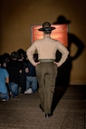 U.S. Marine Corps Drill Instructor Sgt. Natali Morenogardez with Receiving Company, Support Battalion, briefs recruits with Hotel Company, 2nd Recruit Training Battalion, as part of a receiving event at Marine Corps Recruit Depot San Diego, California, Jan. 13, 2025. During the receiving process, recruits are taken to the United States Organizations for accountability, checked for contraband, given haircuts, make a scripted phone call home, and issued gear required for training. (U.S. Marine Corps photo by Cpl. Sarah M. Grawcock)