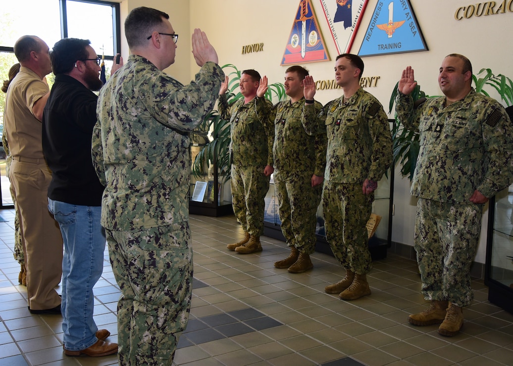 Four Master-at-Arms Reenlist Onboard NAS Meridian