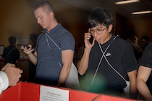 U.S. Marine Corps recruits with Hotel Company, 2nd Recruit Training Battalion, make a phone call home as part of the receiving process at Marine Corps Recruit Depot San Diego, California, Jan. 13, 2024. During the receiving process, recruits are taken to the United States Organizations for accountability, checked for contraband, given haircuts, make a scripted phone call home, and issued gear required for training. (U.S. Marine Corps photo by Cpl. Sarah M. Grawcock)