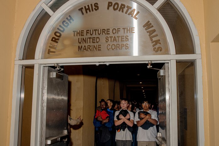 U.S. Marine Corps recruits with Hotel Company, 2nd Recruit Training Battalion, are briefed as part of a receiving event at Marine Corps Recruit Depot San Diego, California, Jan. 13, 2025. During the receiving process, recruits are taken to the United States Organizations for accountability, checked for contraband, given haircuts, make a scripted phone call home, and issued gear required for training. (U.S. Marine Corps photo by Cpl. Sarah M. Grawcock)