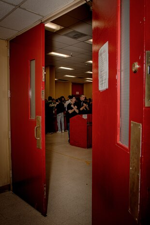 U.S. Marine Corps recruits with Hotel Company, 2nd Recruit Training Battalion, are briefed as part of a receiving event at Marine Corps Recruit Depot San Diego, California, Jan. 13, 2025. During the receiving process, recruits are taken to the United States Organizations for accountability, checked for contraband, given haircuts, make a scripted phone call home, and issued gear required for training. (U.S. Marine Corps photo by Cpl. Sarah M. Grawcock)
