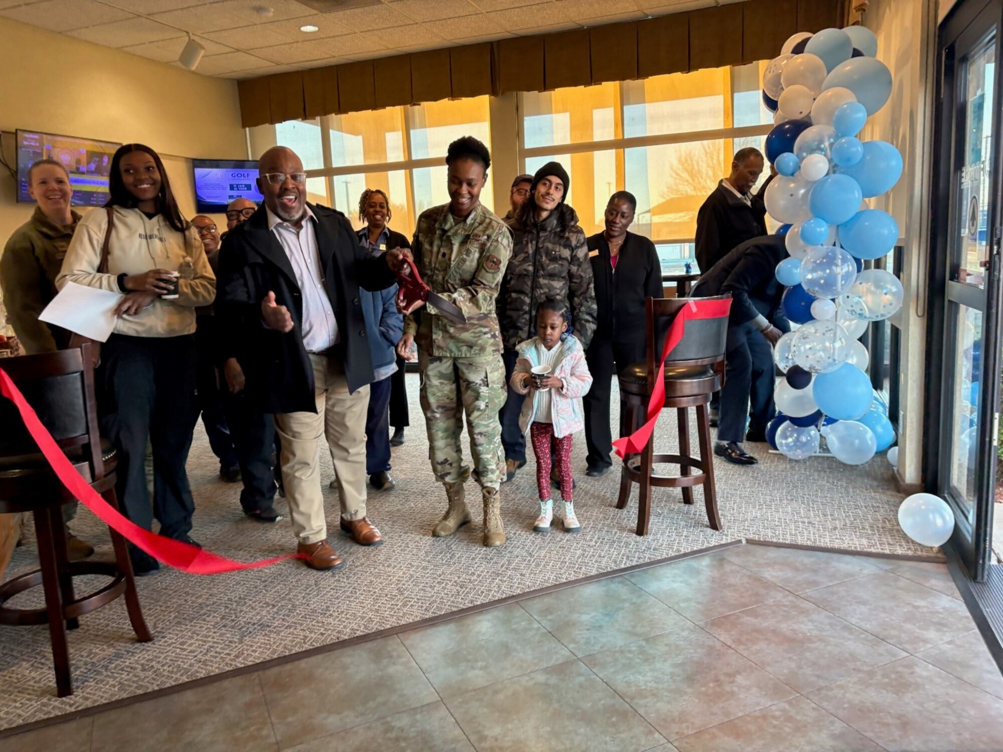 Robert Collins Jr., Red River Inn lodging manager, and U.S. Air Force Lt. Col. Aisha Lockett, 97th Force Support Squadron commander, mark the official opening of the new Smart Start Breakfast Program with a ribbon cutting at Altus Air Force Base, Oklahoma, Jan. 13, 2025. Designed to fuel busy mornings, the program offers guests convenient and nutritious grab-and-go options to kick start their day. (Courtesy photo)