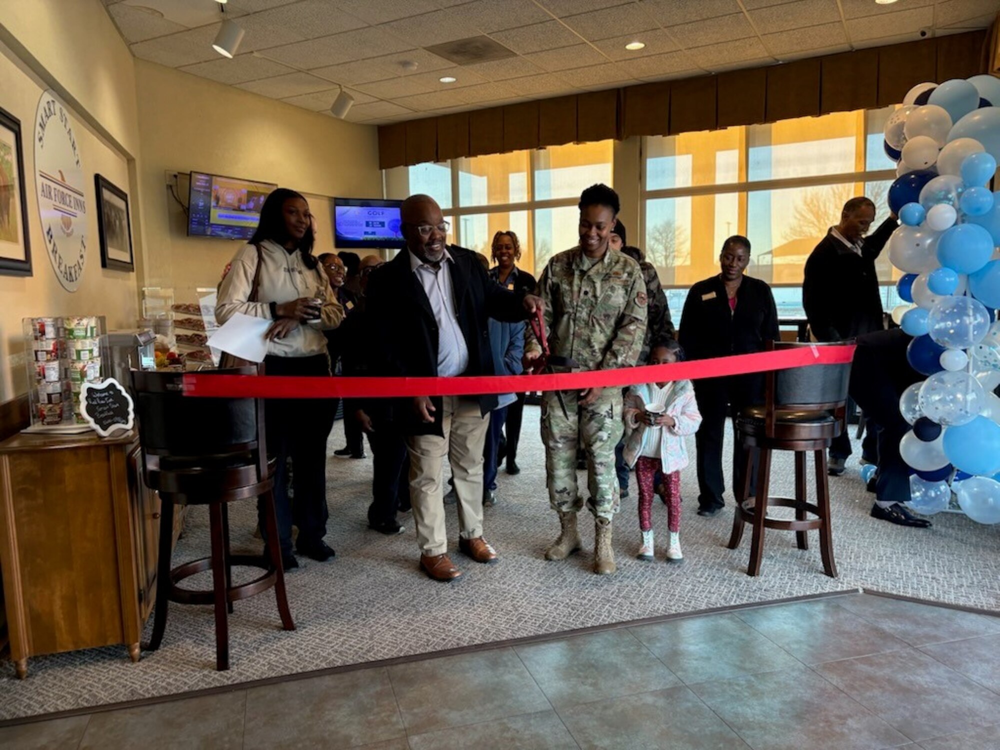 Robert Collins Jr., Red River Inn lodging manager, ceremonially opens the new Smart Start Breakfast Program at Altus Air Force Base, Oklahoma, Jan. 13, 2025. This program provides a selection of grab-and-go options, including fresh fruit, yogurt, granola bars, pastries, and beverages like coffee and juice. (Courtesy photo)