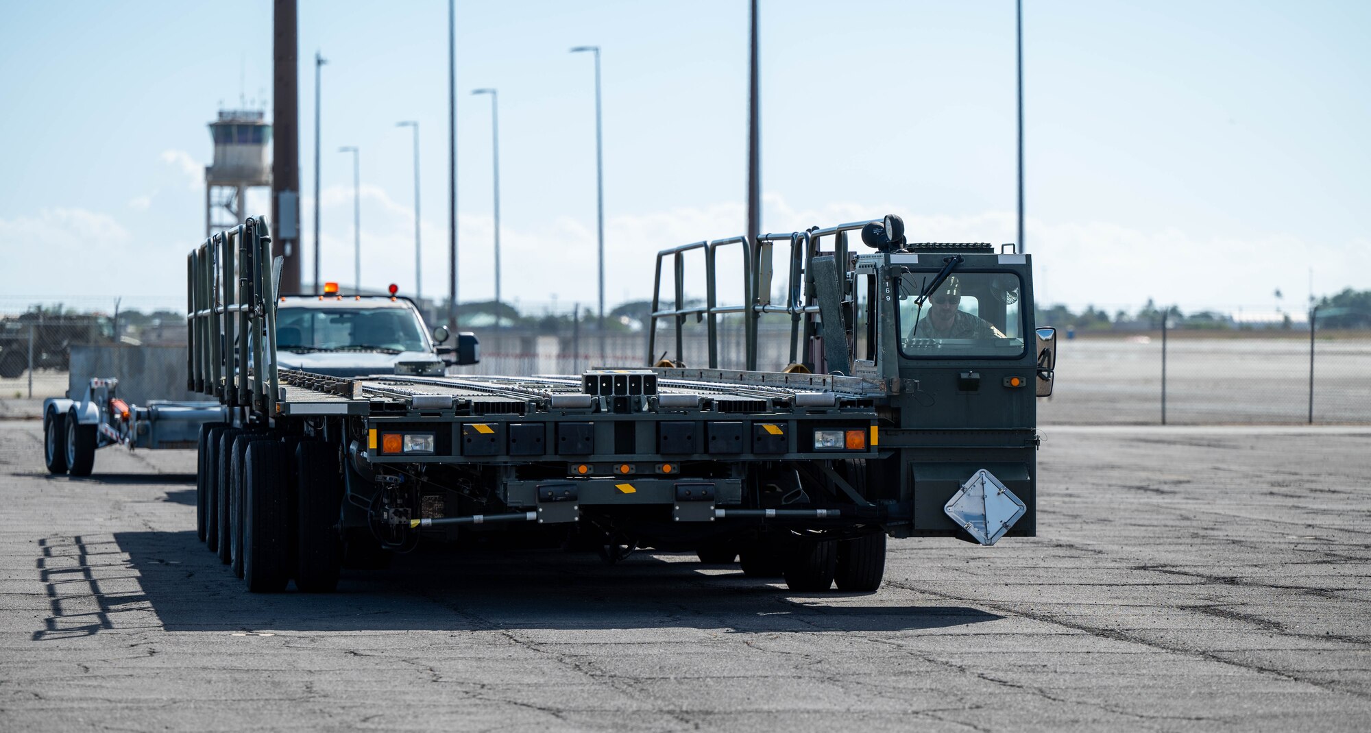 A large green vehicle moves.