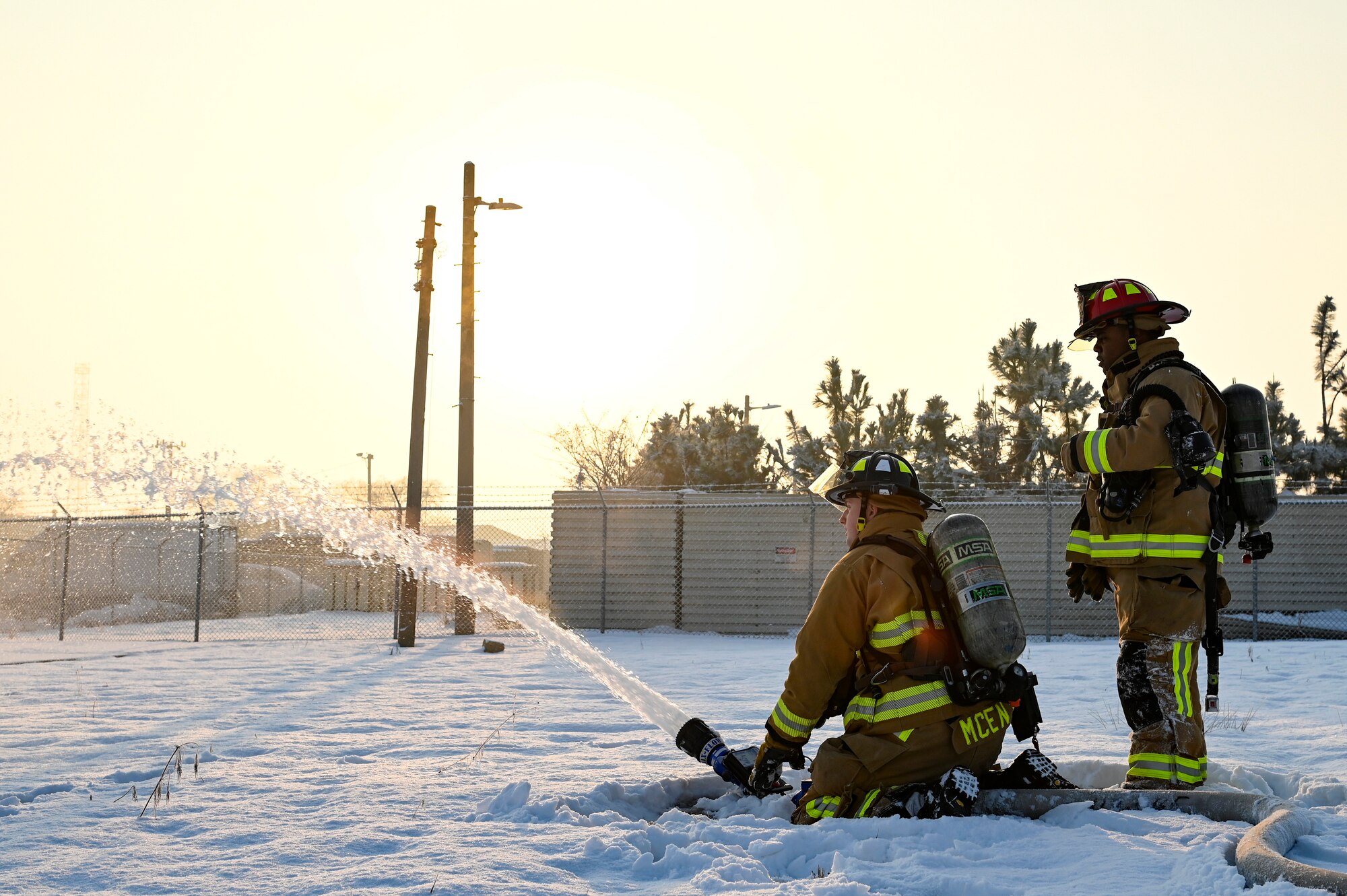 Senior Airman Benjamin McEntire, 8th Civil Engineer Squadron firefighter, puts out a simulated explosion while U.S. Air Force Staff Sgt. Austin James, 8th CES firefighter, monitors during Beverly Pack 25-1.