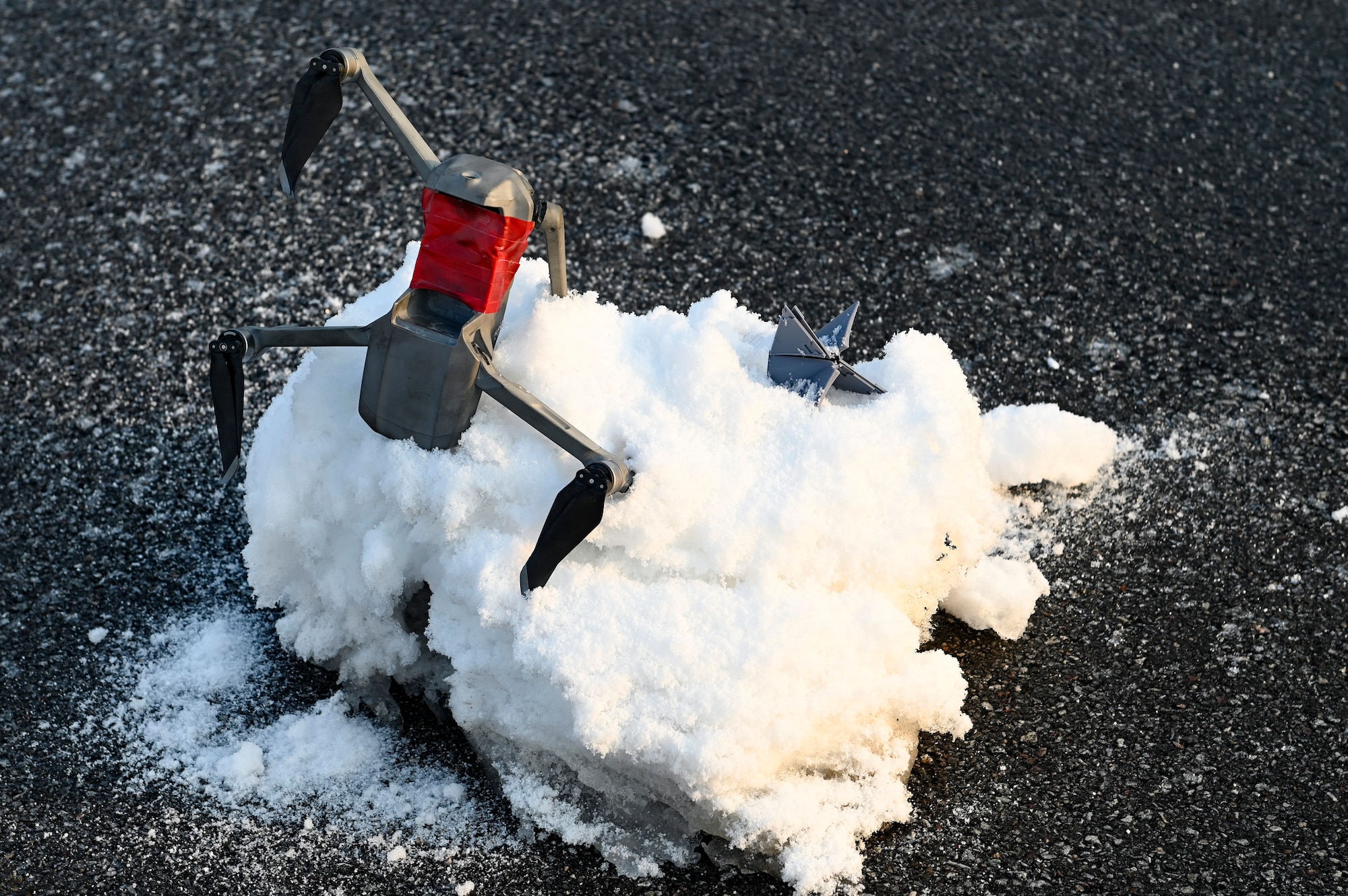 A simulated downed drone and ordnance lie in the snow for a training exercise during Beverly Pack 25-1.
