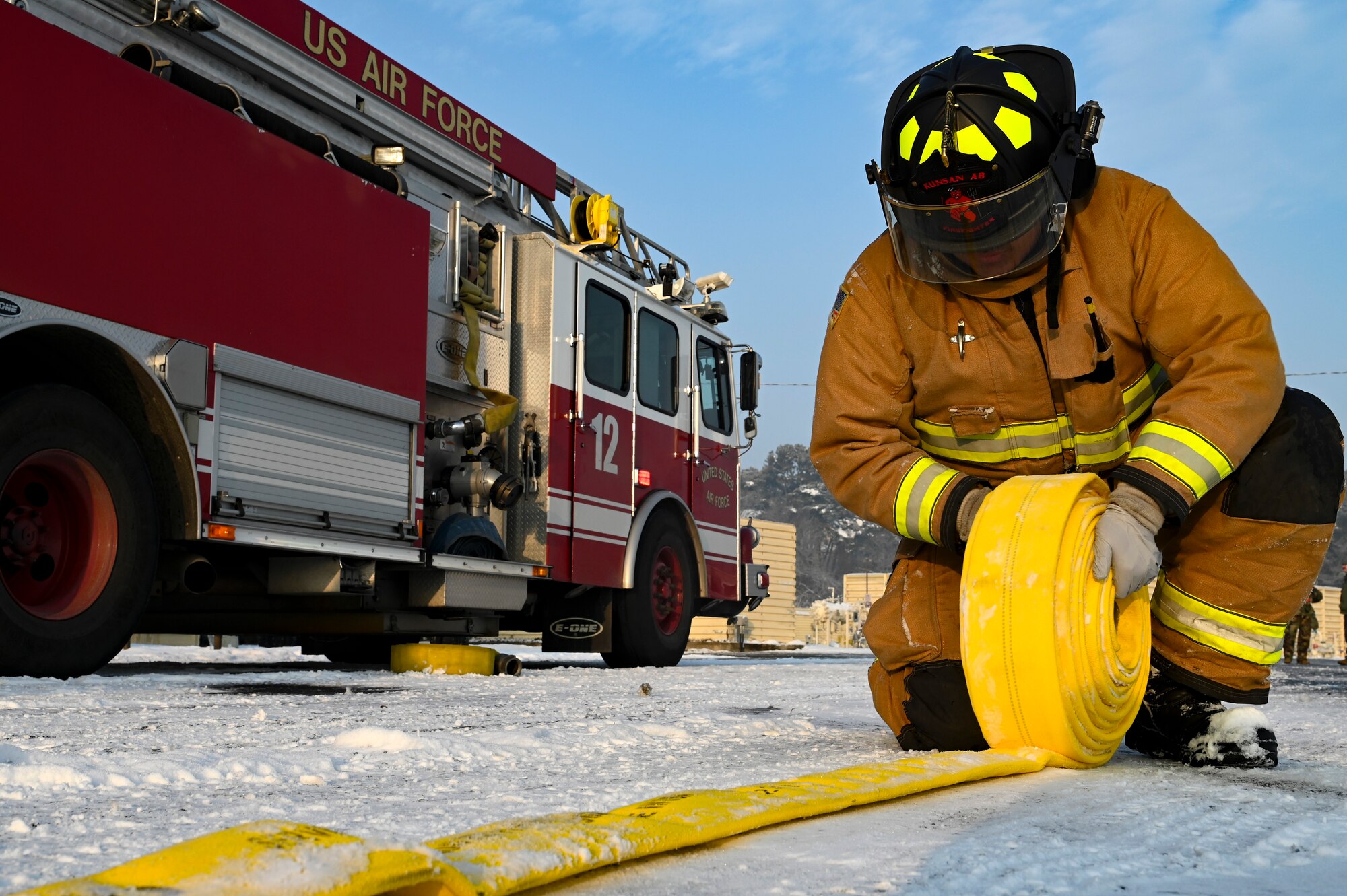 Airman First Class Daniel Rodriguez, 8th Civil Engineer Squadron firefighter, wraps up a firehose during Beverly Pack 25-1.