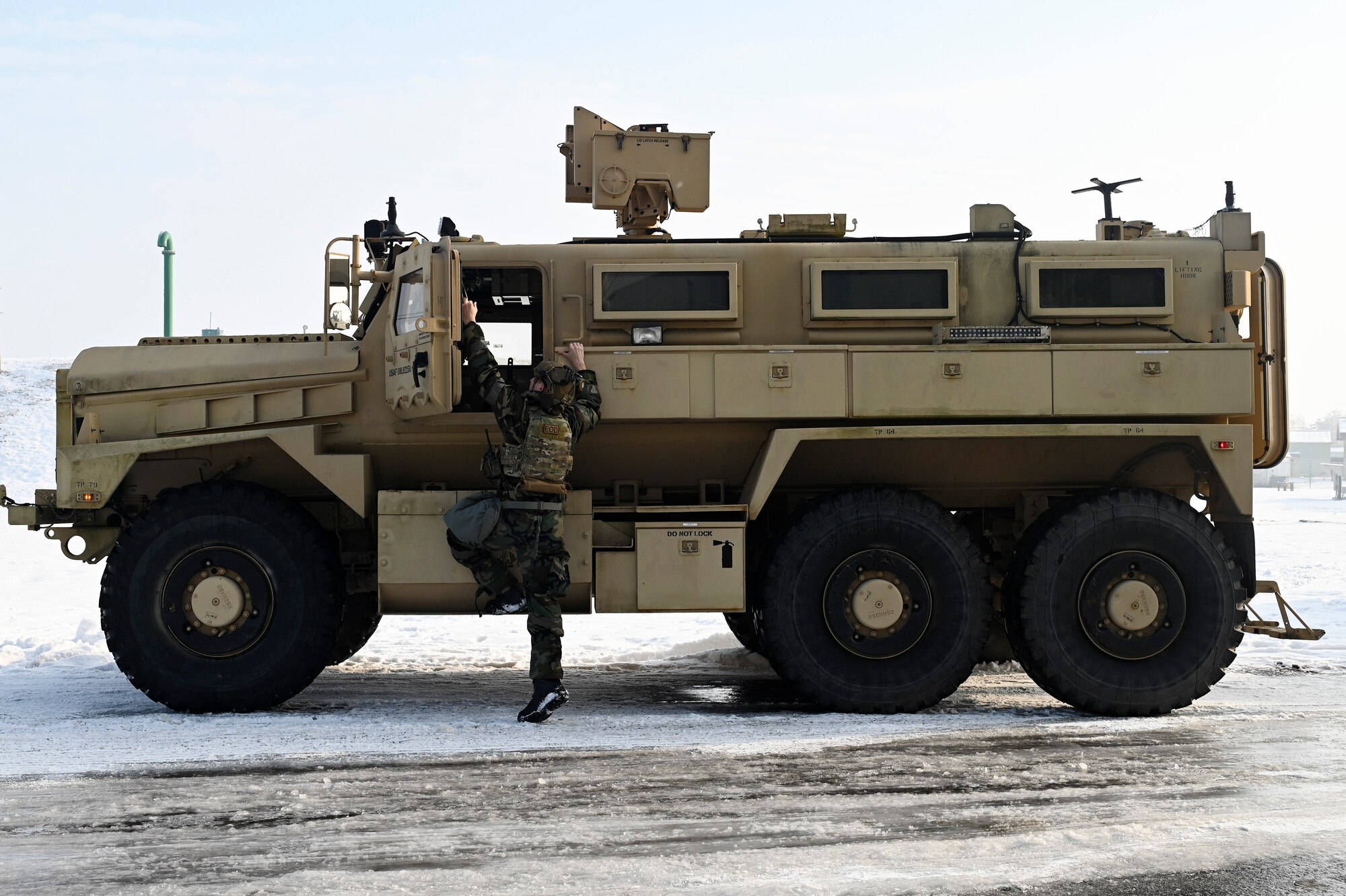 Airman First Class Cameron Poe, 8th Civil Engineer Squadron explosive ordnance disposal secondary team member, climbs into a joint EOD rapid response vehicle during Beverly Pack 25-1.