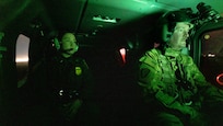 A U.S. Border Patrol agent alongside U.S. Soldiers with Bravo Company, 3rd Battalion, 140th Aviation Regiment assigned to Task Force Sentinel, conduct aerial reconnaissance
