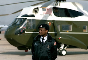 On President Ronald W. Reagan’s Inauguration Day Jan. 20, 1981, an Air Force security policeman stands guard on the side of one of the presidential helicopters (VH-3A) at Andrews Air Force Base.