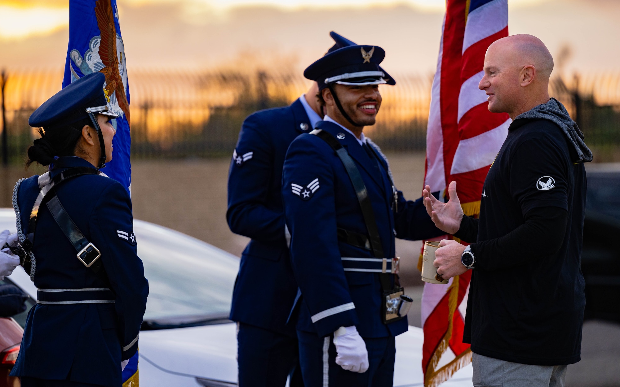 U.S. Air Force Brig. Gen. David Berkland, 56th Fighter Wing commander (right), converses with 56th Fighter Wing Honor Guard Airmen.