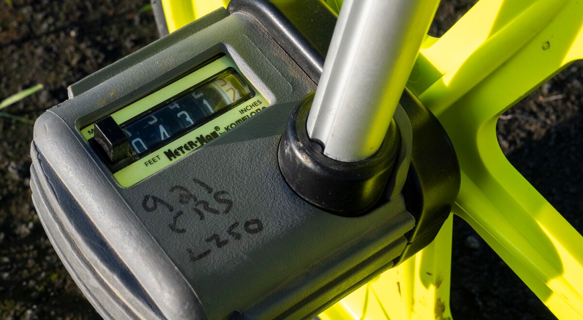 A distance measurement wheel shows the length of an unprepared flight line in Rio Vista, California, Jan. 10, 2025.