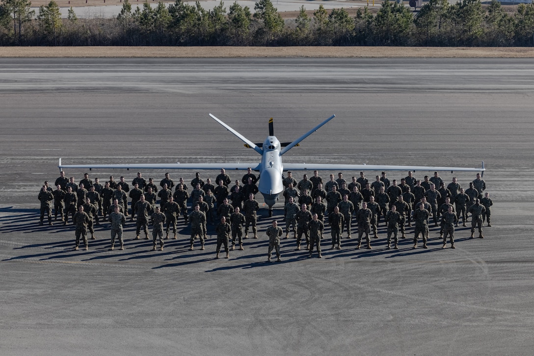 U.S. Marines with Marine Unmanned Aerial Vehicle Training Squadron (VMUT) 2 pose for a photo at Marine Corps Air Station Cherry Point, North Carolina, Jan. 16, 2025. VMUT-2 is a subordinate unit of 2nd Marine Aircraft Wing, the aviation combat element of II Marine Expeditionary Force. (U.S. Marine Corps photo by Lance Cpl. Orlanys Diaz Figueroa)