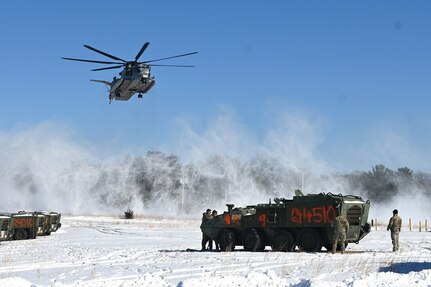 A Marine CH-53 Super Stallion helicopter from Marine Heavy Helicopter Squadron 772 out of Joint Base Maguire-Dix-Lakehurst, New Jersey, lands at Fort Indiantown Gap, Pa., Jan. 22, 2025, prior to air-lifting eight decommissioned Army Stryker vehicles to Fort Indiantown Gap’s impact area. A team of Air Force sling-load specialists from the 621st Contingency Response Group sling-loaded the Strykers to the helicopter. (Pennsylvania National Guard photo by Brad Rhen)