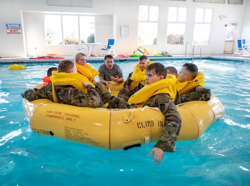 A survival, evasion, resistance, escape specialist explains what to do in a water rescue scenario during survival training at Scott Air Force Base on Jan. 16, 2025. SERE is responsible for equipping Airmen with the knowledge, tools, and strategies necessary to survive and safely return from any mission, regardless of the circumstances. (U.S. Air Force photo by Rachel Sansano)