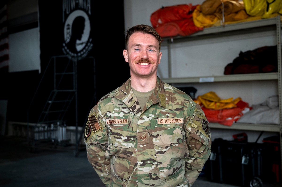 U.S. Air Force Senior Airman Christopher VanHeuvelen, 375th Operational Support Squadron survival, evasion, resistance, escape specialist, poses for a photo at Scott Air Force Base, Dec. 11, 2024. SERE is part of the Guardian Angel weapon system, and focuses on Personnel Recovery. (U.S. Air Force photo by Rachel Sansano)