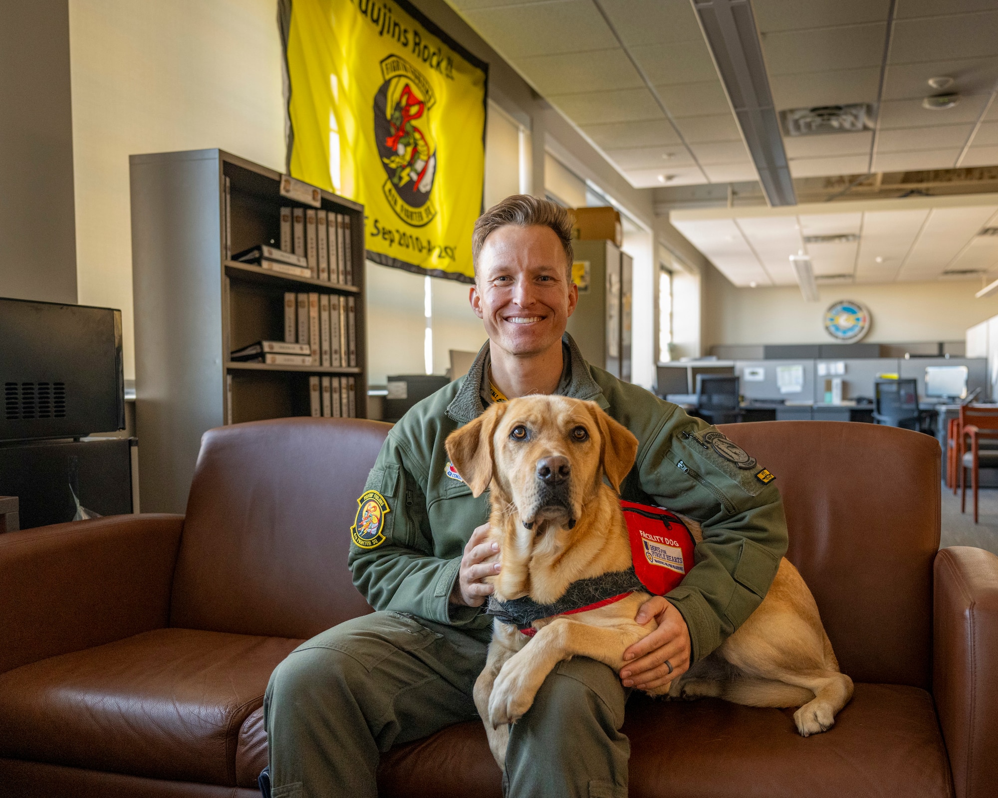 A photo of a pilot and a dog