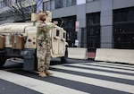 Virginia National Guard Soldiers assigned to Joint Task Force–District of Columbia  (JTF-DC) assist with traffic control in Washington, D.C., on Jan. 19, 2025, in support of the 60th Presidential Inauguration. Approximately 8,000 National Guard service members from approximately 40 states and territories comprise JTF-DC to support the 60th Presidential Inauguration, continuing a legacy that began in 1789 when their predecessors escorted George Washington to the first inauguration. At the request of civil authorities, these National Guard service members provide critical support such as crowd management, traffic control points, CBRN response, civil disturbance response and sustainment operations. Their expertise and seamless collaboration with interagency partners help ensure a safe and peaceful transition of power during this historic event. (U.S. Army National Guard Photo by Spc. Ericka Gillespie).