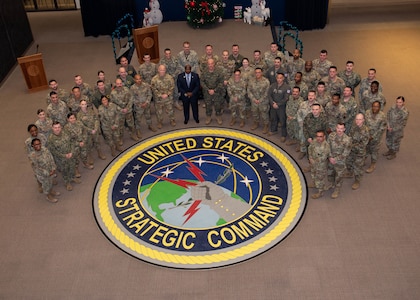 Group photo of GATEWAY Class 25-1 at Offutt Air Force Base, Nebraska featuring retired Command Sgt. Maj. Patrick Alston, National Defense University Senior Fellow and U.S. Marine Corps Sgt. Maj. Howard L. Kreamer, USSTRATCOM Command Senior Enlisted Leader.