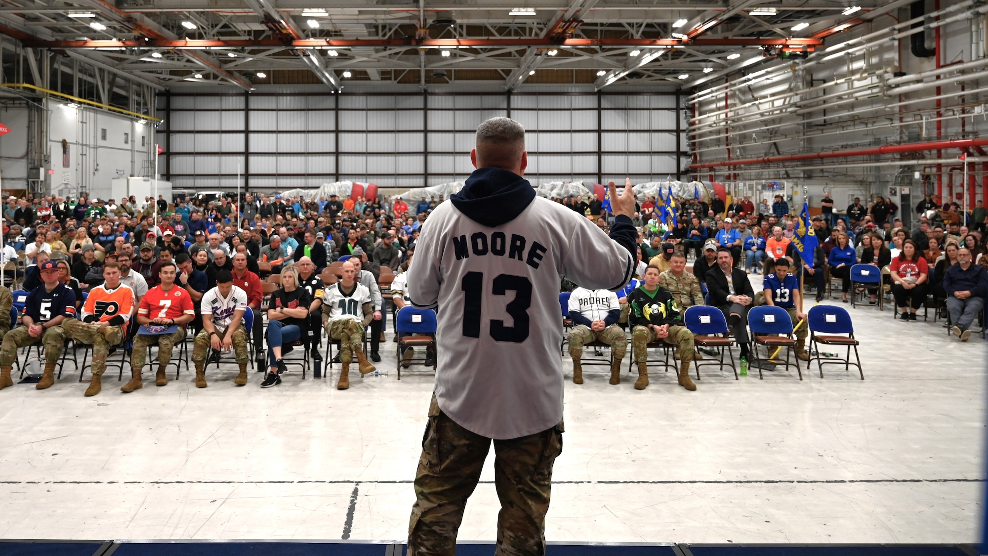 A man on a stage addressing a crowd
