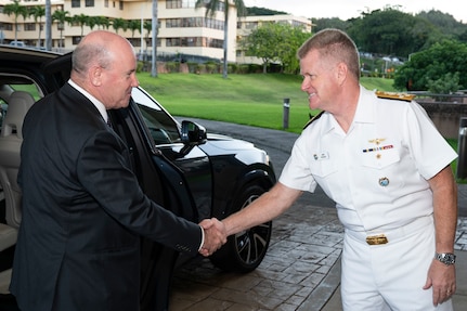 Adm. Samuel J. Paparo, commander of U.S. Indo-Pacific Command, greets Australian Secretary of the Department of Defence Greg Moriarty at USINDOPACOM headquarters on Camp H.M. Smith in Hawaii, Jan. 21, 2025.