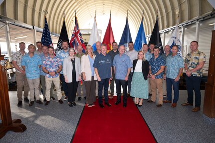 Adm. Samuel J. Paparo, center left, commander of U.S. Indo-Pacific Command, and Australian Secretary of the Department of Defence Greg Moriarty, center right, join together for a group photo prior to Moriarty receiving a tour of Pearl Harbor, Jan. 21, 2025.