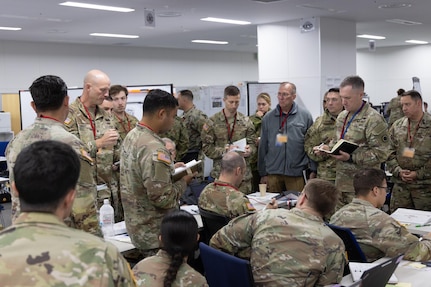 U.S. Army Col. Andrew Knight, 17th Artillery Brigade commander, briefs U.S. Army Brig. Gen. Bernard J. Harrington, I Corps deputy commanding general, as part of Yama Sakura 87 and Warfighter 25-02 at Camp Asaka, Japan, Dec. 8, 2024.