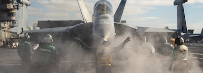 PACIFIC OCEAN (Jan. 18, 2025) — A Sailor directs an E/A-18G Growler from the 