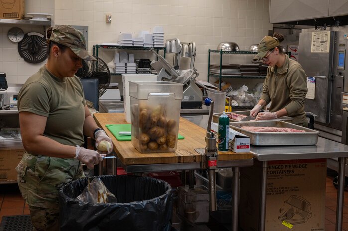 Airmen prepare food