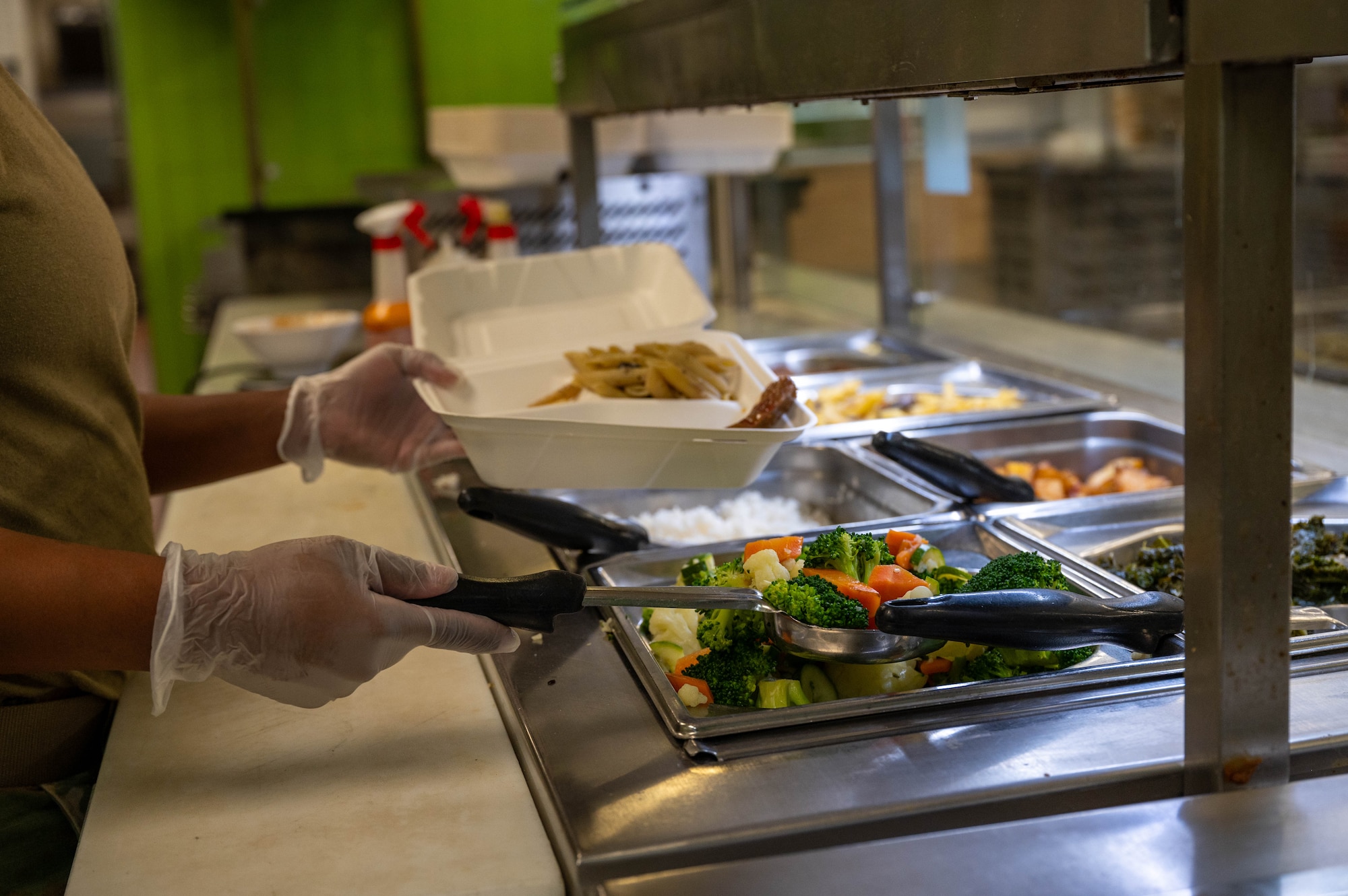 An Airman serves food
