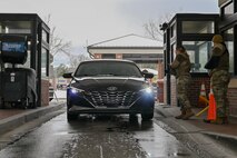 Two Airman at the front gate of Joint Base Charleston checking IDs