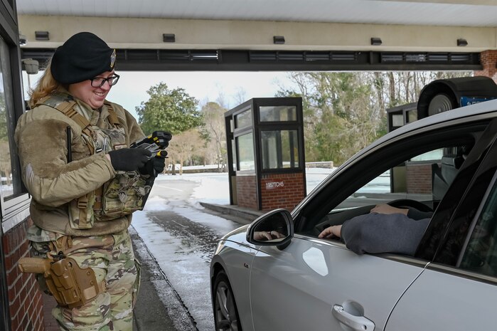 An Airman check ID's at Joint Base Charleston