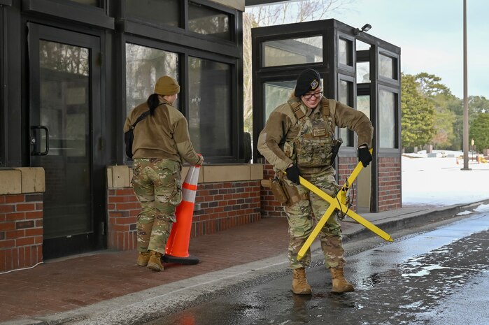 Two Airman at the front gate of Joint Base Charleston