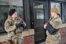 Two Airman at the front gate of Joint Base Charleston