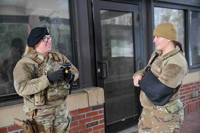 Two Airman at the front gate of Joint Base Charleston