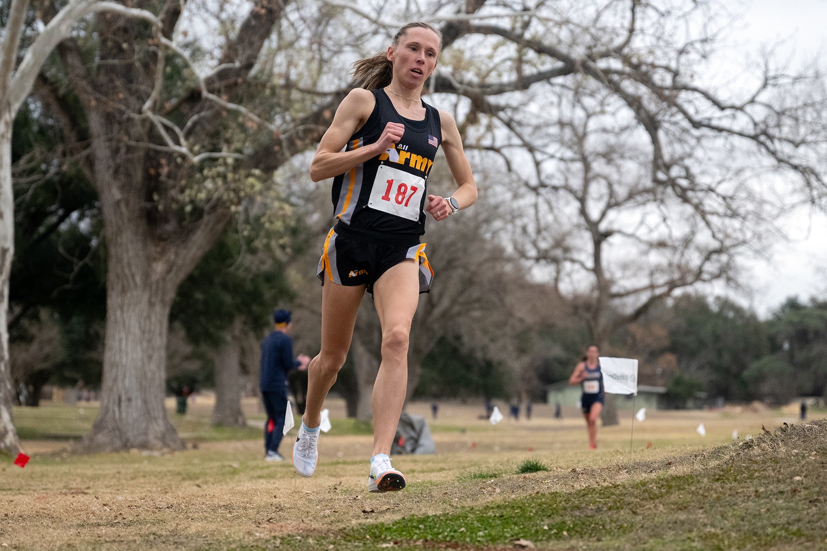 Army Sgt. Colett Rampf-Cribbs races to first place in the women’s divsion of the 2025 Armed Forces Men’s and Women’s Cross Country Championship at Windcrest Golf Club in Windcrest, Texas, on Jan. 25, 2025. (DoD photo by EJ Hersom)