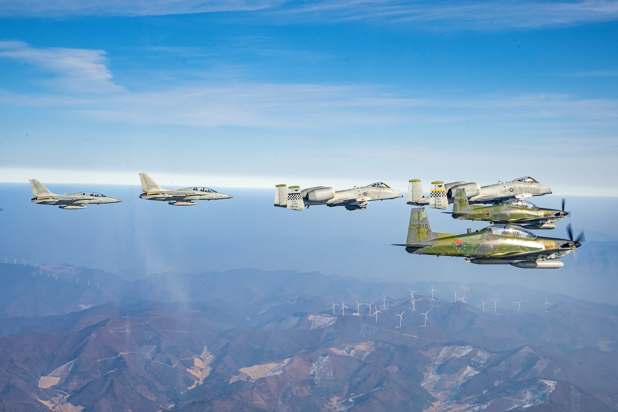 Republic of Korea Air Force FA-50 Golden Eagles, U.S. Air Force A-10 Thunderbolt IIs, and ROKAF KA-1 Woongbis conduct joint aerial operations over the Republic of Korea