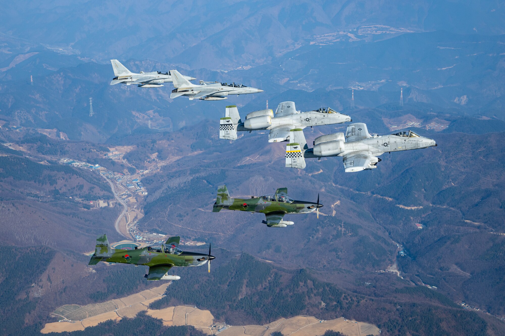 Republic of Korea Air Force FA-50 Golden Eagles, U.S. Air Force A-10 Thunderbolt IIs, and ROKAF KA-1 Woongbis conduct joint aerial operations over the Republic of Korea