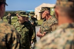U.S. Marine Corps Lt. Gen. Roger Turner, commanding general of III Marine Expeditionary Force, communicates with Japan Ground Self-Defense Force Lt. Gen. Masayoshi Arai, commanding general of the Western Army, during exercise Resolute Dragon 24 at JGSDF Camp Yonaguni, Okinawa, Japan, August 4, 2024. RD 24 is an annual bilateral exercise in Japan that strengthens the command, control, and multi-domain maneuver capabilities of U.S. Marines in the III Marine Expeditionary Force and Japan Self-Defense Force personnel, with a focus on controlling and defending key maritime terrain. (U.S. Marine Corps photo by Lance Cpl. Matthew Morales)
