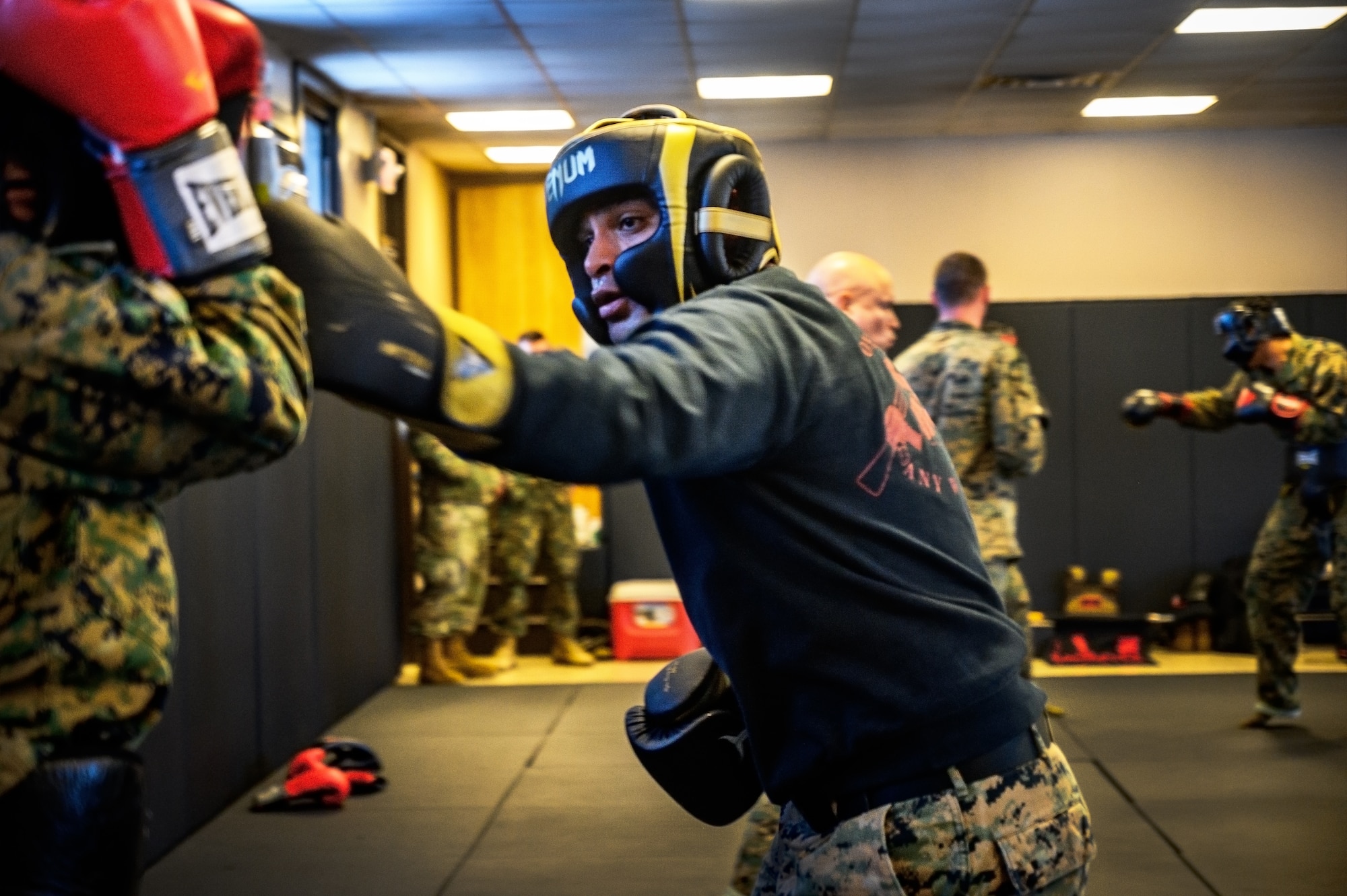 U.S. Marine Corps Cpl. Reed Lyons, Marine Aircraft Group 49 Marine Corps Martial Arts Program trainee and U.S. Marine Corps. Staff Sgt. Bryan Greenwood, MAG 49 MCMAP trainee, perform water-based exercises while at Joint Base McGuire-Dix-Lakehurst, N.J., Jan. 10, 2025. MCMAP is a combat system that combines existing and new hand-to-hand and close quarters combat techniques with morale, team-building functions and instruction in the warrior ethos. The techniques used by MCMAP vary in degrees of lethality allowing members to qualify and master up to six disciplines through continuation in the program. (U.S. Air Force photo by Senior Airman Matt Porter)