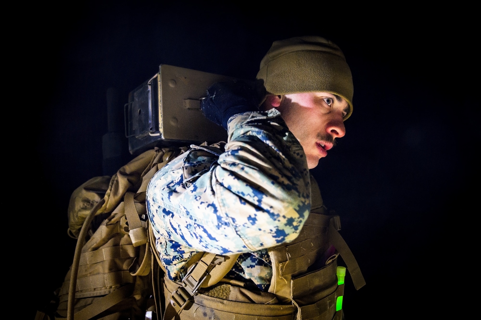 U.S. Marine Corps Cpl. Reed Lyons, Marine Aircraft Group 49 Marine Corps Martial Arts Program trainee, carries an ammo can at Joint Base McGuire-Dix-Lakehurst, N.J., Jan. 16, 2025. MCMAP is a combat system that combines existing and new hand-to-hand and close quarters combat techniques with morale, team-building functions and instruction in the warrior ethos. The techniques used by MCMAP vary in degrees of lethality allowing members to qualify and master up to six disciplines through continuation in the program. (U.S. Air Force photo by Senior Airman Matt Porter)