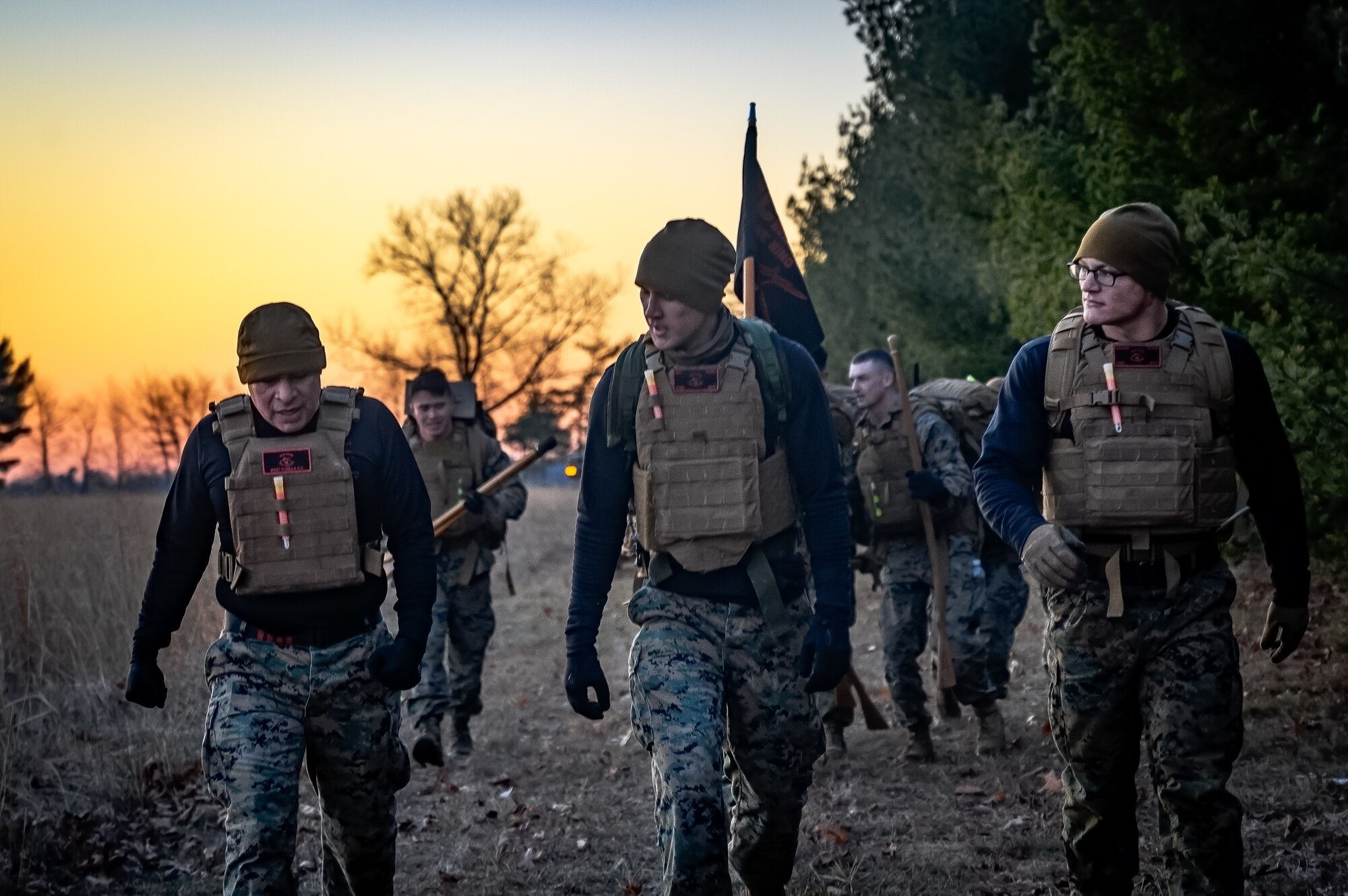U.S. Marines assigned to Marine Aircraft Group 49 embark on a ruck march during the Marine Corps Martial Arts Program at Joint Base McGuire-Dix-Lakehurst, N.J., Jan. 16, 2025. MCMAP is a combat system that combines existing and new hand-to-hand and close quarters combat techniques with morale, team-building functions and instruction in the warrior ethos. The techniques used by MCMAP vary in degrees of lethality allowing members to qualify and master up to six disciplines through continuation in the program. (U.S. Air Force photo by Senior Airman Matt Porter)