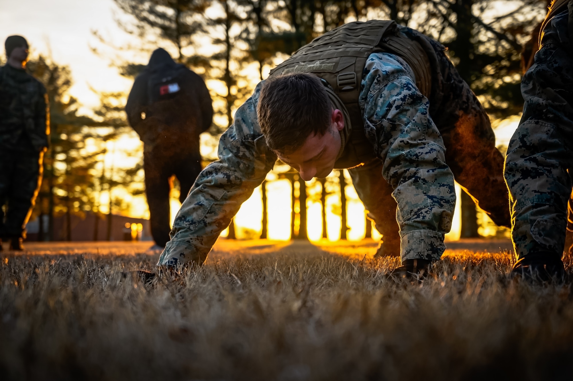 U.S. Marines assigned to Marine Aircraft Group 49 perform an exercise circuit during the Marine Corps Martial Arts Program at Joint Base McGuire-Dix-Lakehurst, N.J., Jan. 16, 2025. MCMAP is a combat system that combines existing and new hand-to-hand and close quarters combat techniques with morale, team-building functions and instruction in the warrior ethos. The techniques used by MCMAP vary in degrees of lethality allowing members to qualify and master up to six disciplines through continuation in the program. (U.S. Air Force photo by Senior Airman Matt Porter)