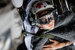 Sailors carry Intelligence Specialist 2nd Class Isaac Eaker, from La Jolla, California, assigned to intelligence department’s satellite imagery analyzation division, to an elevator on the flight deck during a medical drill aboard Nimitz-class aircraft carrier USS George Washington (CVN 73) while underway in the Pacific Ocean.