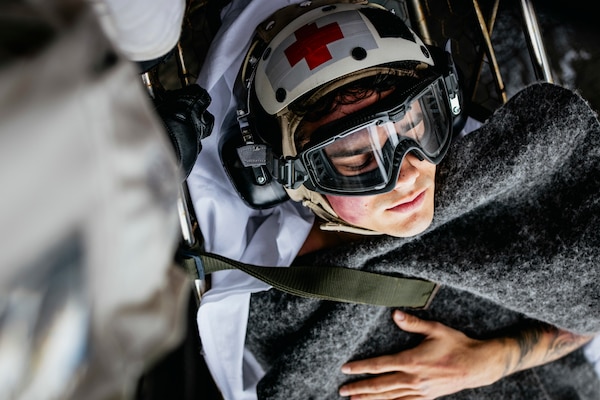 Sailors carry Intelligence Specialist 2nd Class Isaac Eaker, from La Jolla, California, assigned to intelligence department’s satellite imagery analyzation division, to an elevator on the flight deck during a medical drill aboard Nimitz-class aircraft carrier USS George Washington (CVN 73) while underway in the Pacific Ocean, Nov. 11, 2024. George Washington is 7th Fleet’s premier forward-deployed aircraft carrier, a long-standing symbol of the United States’ commitment to maintaining a free and open Indo-Pacific region, while operating alongside Allies and partners across the U.S. Navy’s largest numbered fleet.