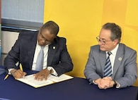 Naval Surface Warfare Center, Philadelphia Division (NSWCPD) Technical Director Nigel C. Thijs, SES and Dr. Giuseppe R. Palmese, Dean, Henry M. Rowan College of Engineering at Rowan University renewed their formal Education Partnership Agreement (EPA) during a signing ceremony at the Glassboro, New Jersey campus on Jan. 22, 2025. (U.S. Navy Photo by Gary Ell/Released)