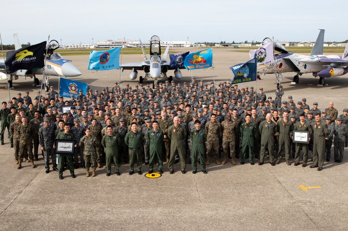 U.S. Marines with Marine Aircraft Group 12, 1st Marine Aircraft Wing and Japan Air Self-Defense Force members with the 303rd and 306th Tactical Fighter Squadrons pose for a photo during exercise Keen Sword 25 at JASDF Komatsu Air Base, Japan, Oct. 31, 2024. Keen Sword is a biennial, joint and bilateral field-training exercise involving U.S. military and Japan Self-Defense Forces personnel, designed to increase readiness and interoperability while strengthening the ironclad U.S.-Japan alliance. (U.S. Marine Corps photo by Staff Sgt. Shannon Doherty)
