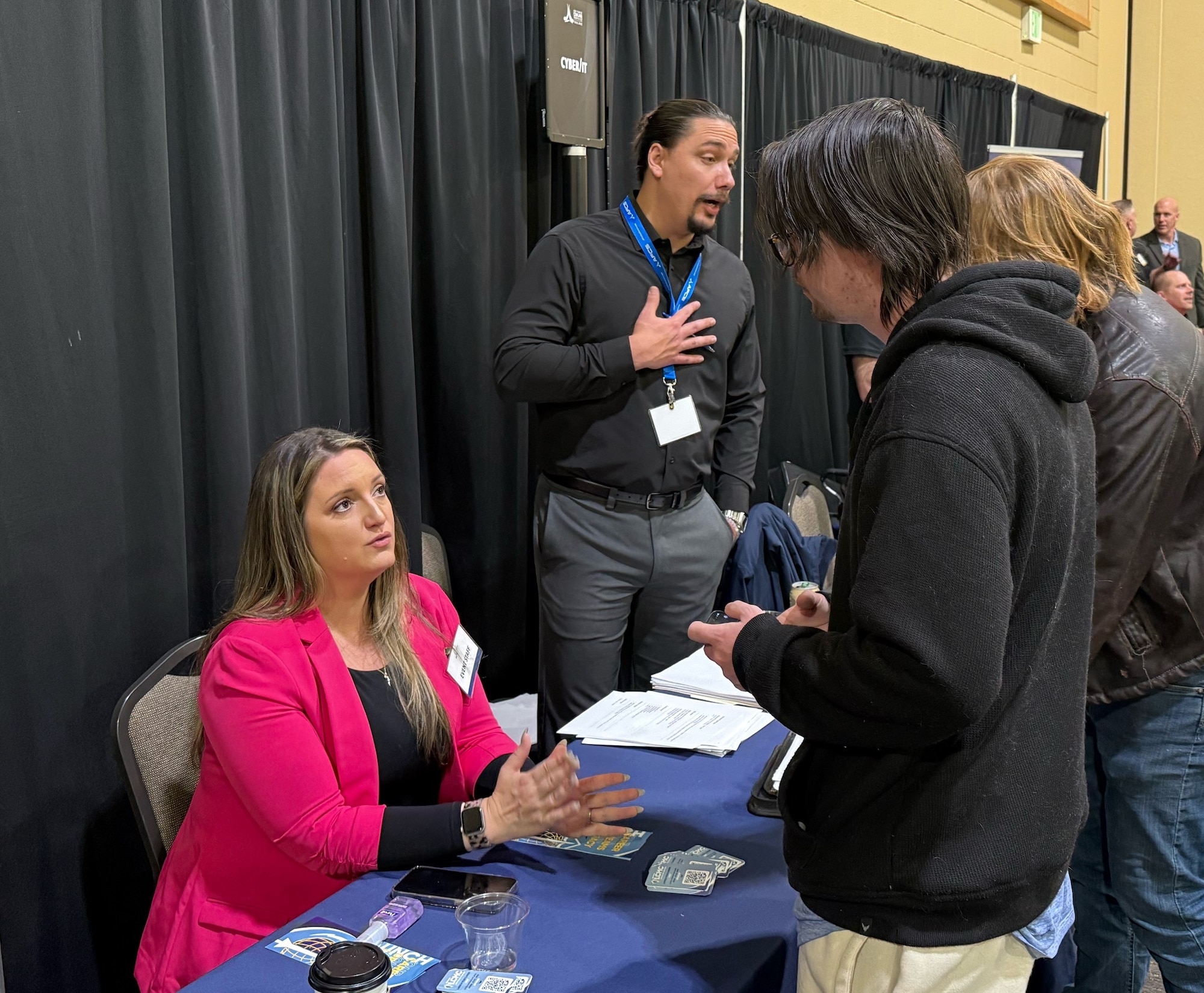 Recruiters from Hill Air Force Base meet with job seekers at a hiring event Jan. 16 at the Davis Conference Center. Job seekers were able to meet with representatives from several base organizations and multiple candidates received job offers. (U.S. Air Force photo by Kendahl Johnson)